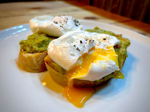 2 Poached eggs and smashed avocado on sourdough toast