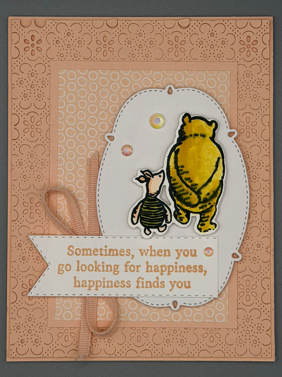 Thumbnail: Layered peach greeting card with embossed floral background, raised illustration of two friends walking, and sentiment “Somet