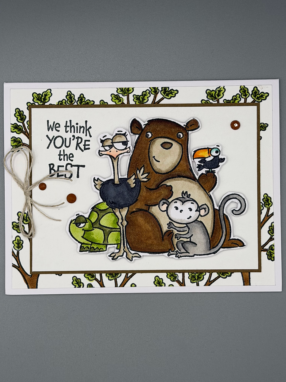 Thumbnail: Handmade greeting card featuring illustrated bear, monkey, ostrich, turtle, and toucan with message “We think you’re the best
