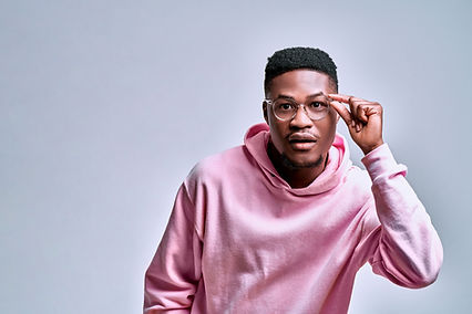 handsome-surprised-african-american-is-holding-glasses-is-shocked-by-what-he-saw-studio.jp