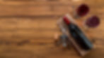 top-view-wine-bottle-with-glass-wooden-background.jpg