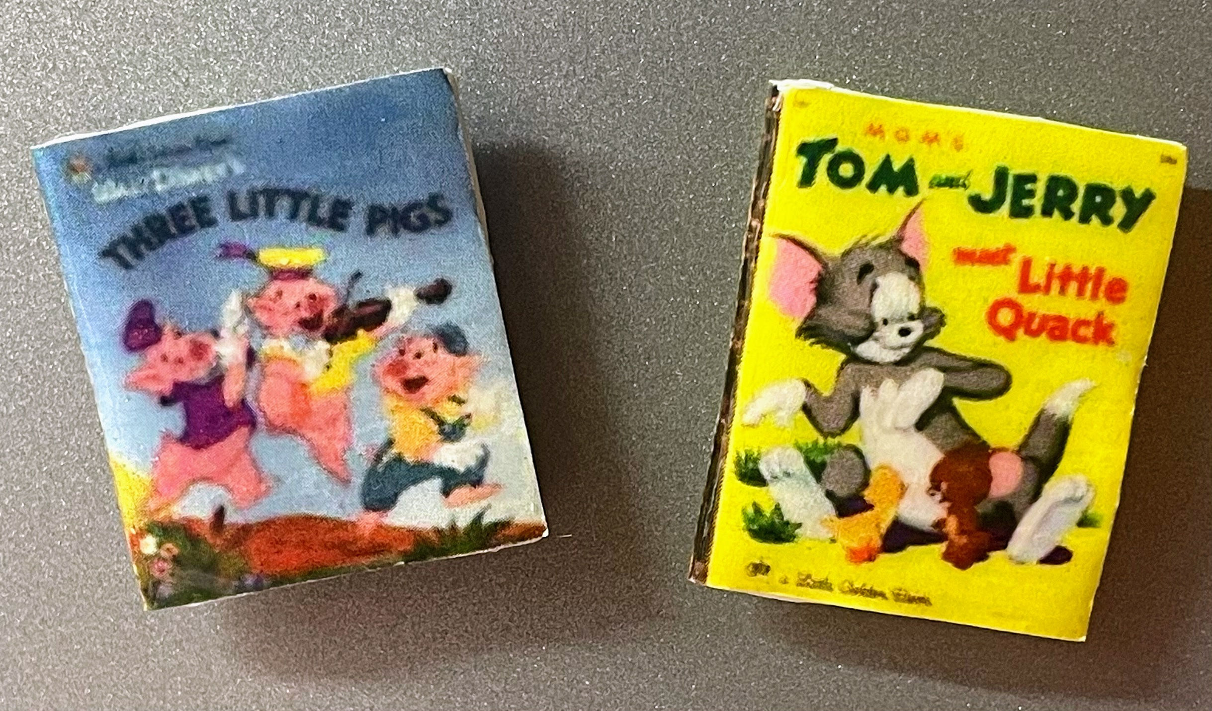 magnets of two books the three little pigs and tom and jerry by little golden books