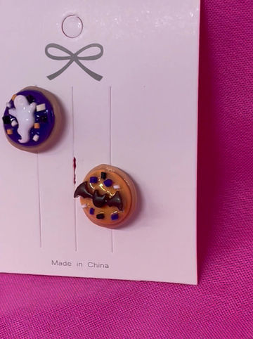 Thumbnail: pins of purple and orange halloween sugar cookies with a white ghost and a black bat and multi colored sprinkles