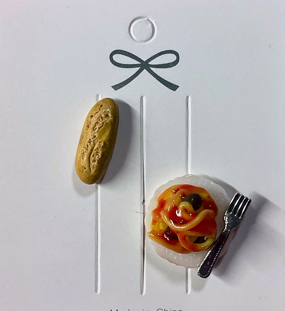 lapel pin of spaghetti & meatballs on a white fancy dinner plate with a tiny fork and a pin of italian bread