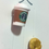 Thumbnail: pins of starbucks hot coffee in a white cup with a lid and a flaky croissant