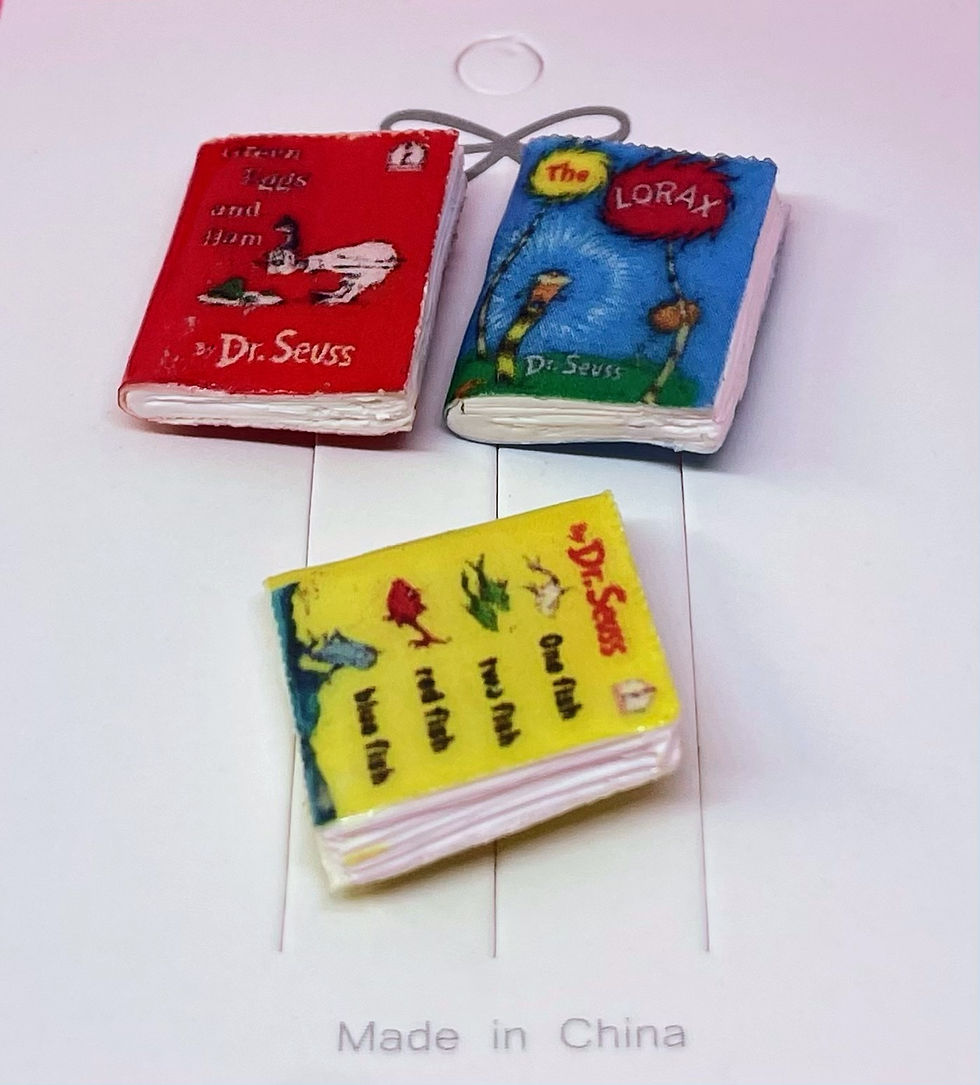 pins of three books green eggs and ham, one fish two fish red fish blue fish and the lorax by dr. seuss