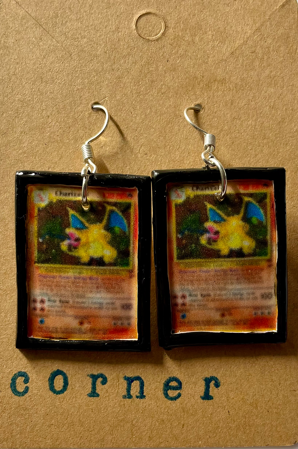 dangle earrings of charizard pokemon cards in a black frame