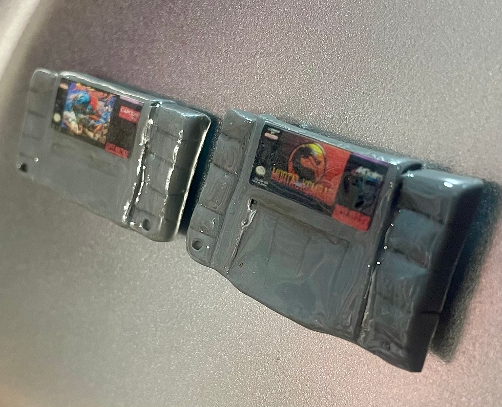 magnets of super nintendo snes game cartridges of street fighter II and mortal kombat
