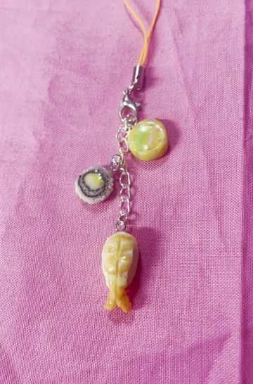 Thumbnail: phone charm of two sushi rolls with salmon and shrimp sashimi