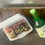 Thumbnail: fridge magnet of Japanese braised pork belly with scallions in a white takeout container and a sake bottle