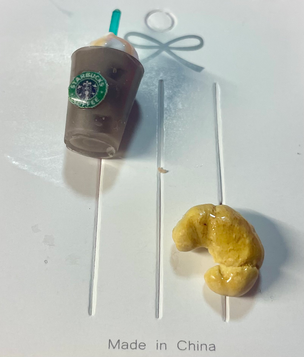 pins of starbucks iced caramel latte with whipped cream and ice and croissant pastries