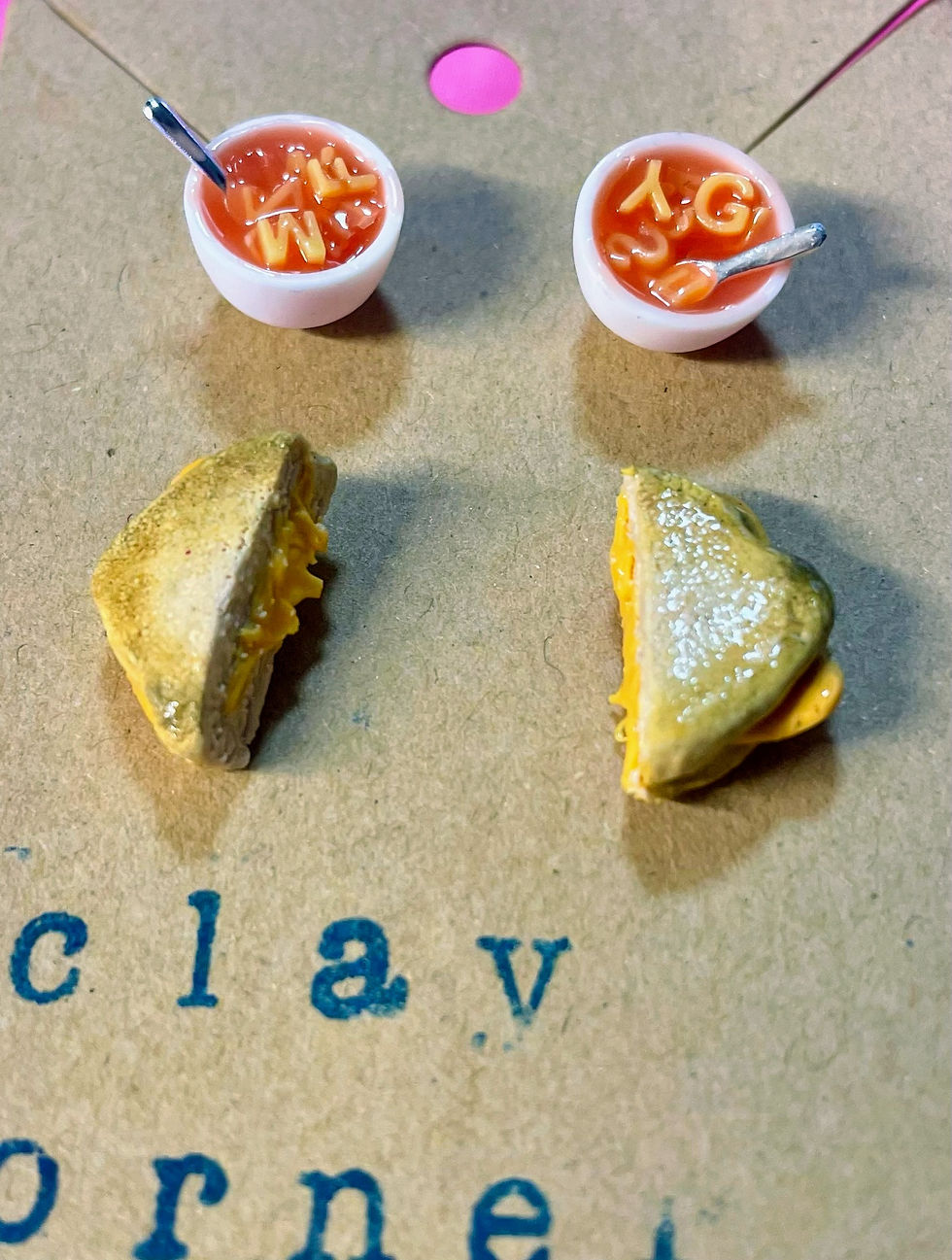 stud earrings of red alphabet soup with tiny spoons with grilled cheese slices and melted cheese