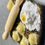 Thumbnail: magnet of a wood cutting board with a pile of flour with a raw egg in it, uncooked raviolis and a rolling pin