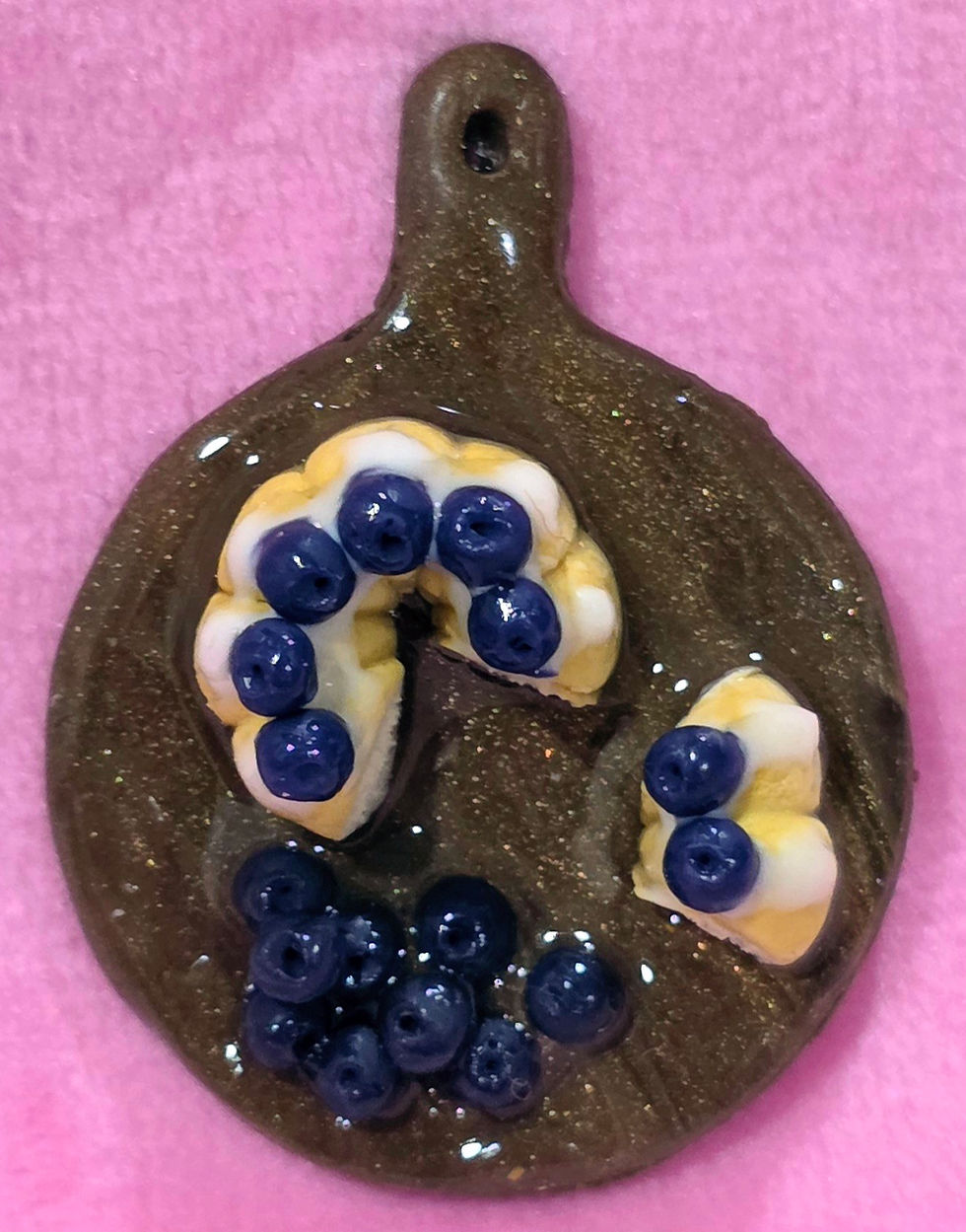 Handmade blueberry bundt cake magnet crafted from polymer clay