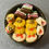 Thumbnail: fridge magnet of Italian butter cookies with red jelly filling and chocolate filling and  rainbow cookies