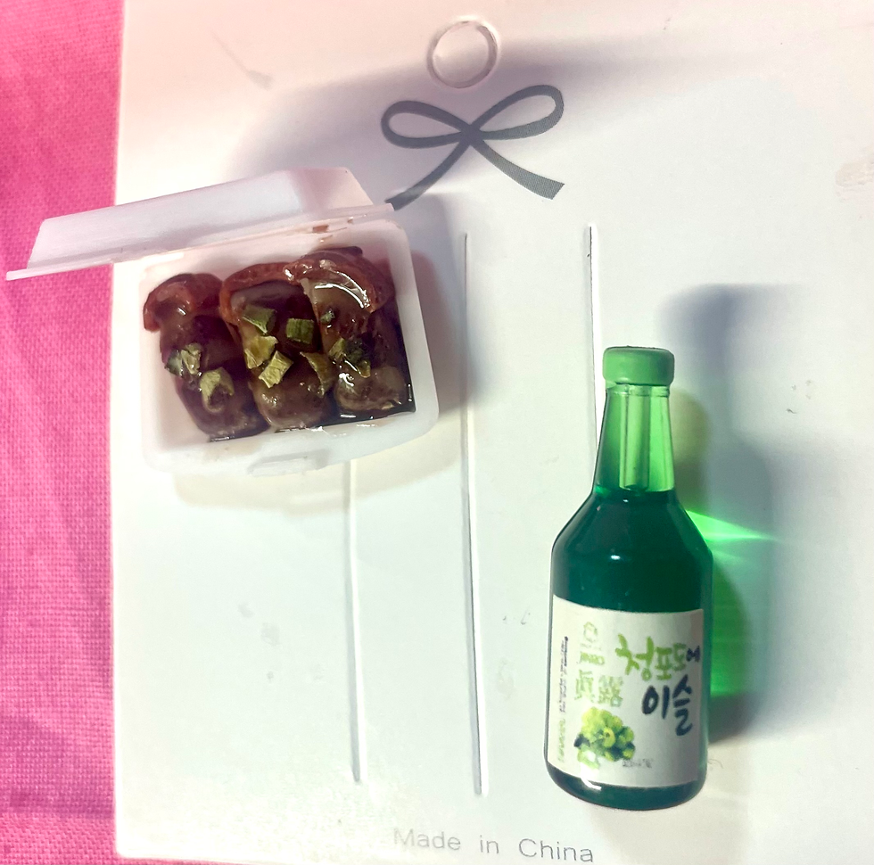 Thumbnail: pins of Japanese braised pork belly with scallions in a white takeout container and a sake bottle