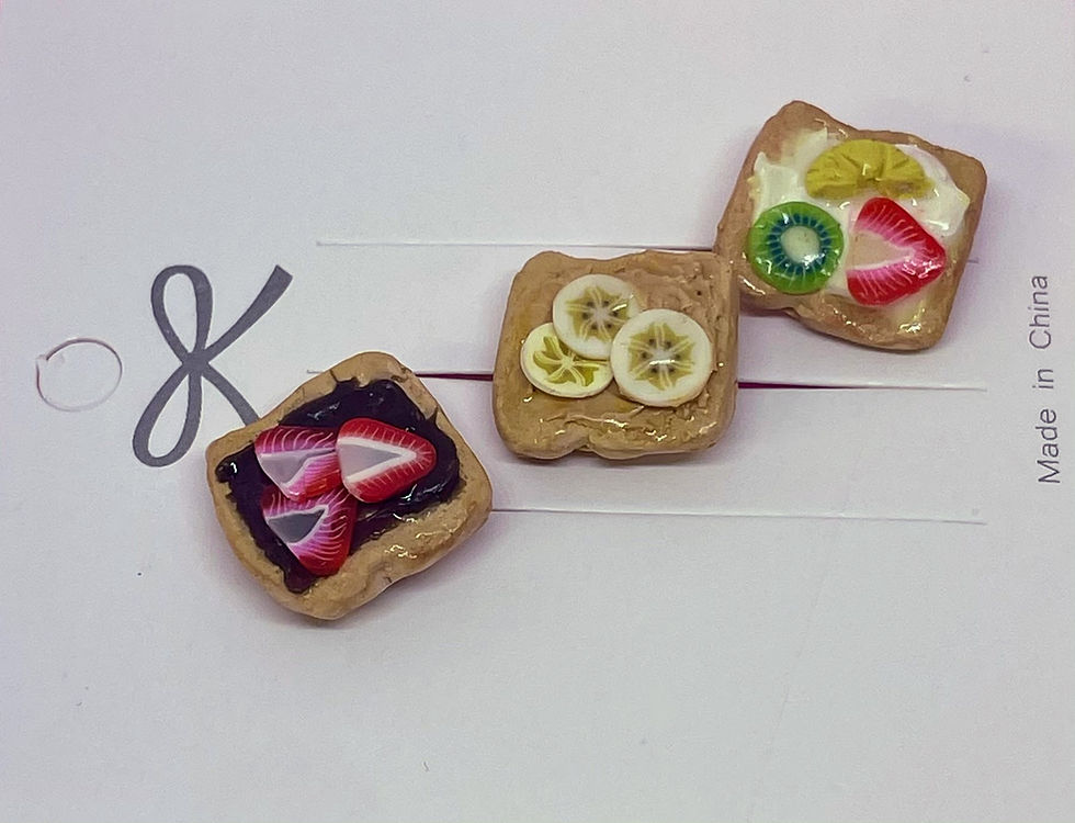 pins of dessert sandwiches one is a strawberry and nuttella and peanut butter and banana and whip cream with fruit