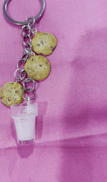 Thumbnail: keychain of three chocolate chip cookies and a glass of milk