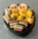 fridge magnet of Italian butter cookies with red jelly filling and chocolate filling and  rainbow cookies