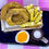 Thumbnail: fridge magnet of onionrings and fries in a checkered container with a beer mug and beer cheese sauce