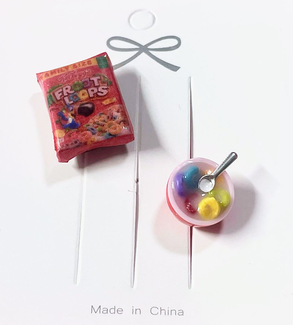 lapel brooch and pin of a fruit loops cereal box and a bowl of cereal with a tiny spoon in it
