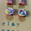 Thumbnail: 2 pairs of stud earrings of froot loops cereal boxes and a bowls of cereal with a tiny spoon  in it
