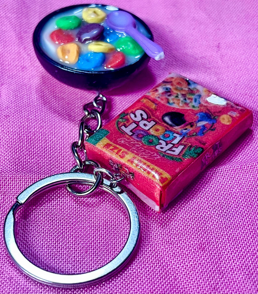Thumbnail: keychain of a froot loops cereal box and a bowl of cereal with a colorful spoon  in it
