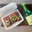 Thumbnail: fridge magnet of Japanese braised pork belly with scallions in a white takeout container and a sake bottle