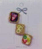 pins of dessert sandwiches one is a strawberry and nuttella and peanut butter and banana and whip cream with fruit