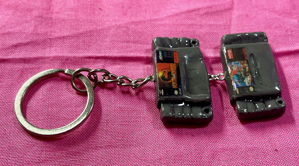 Thumbnail: keychain of super nintendo snes game cartridges of street fighter II and mortal kombat