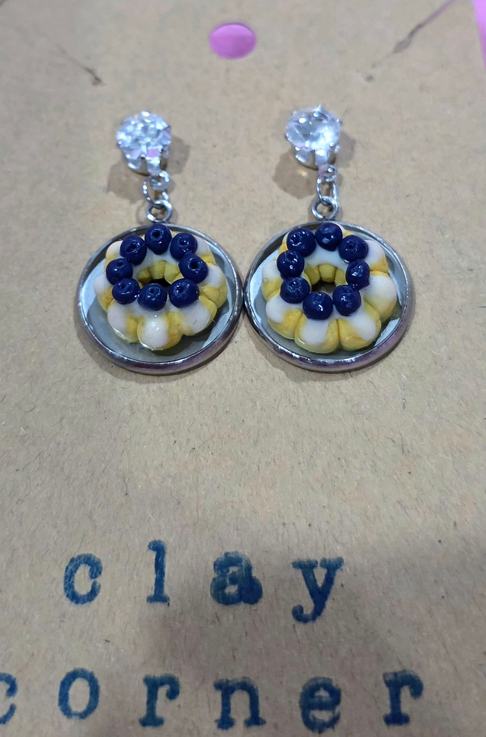 Handmade blueberry bundt cake earrings made from polymer clay