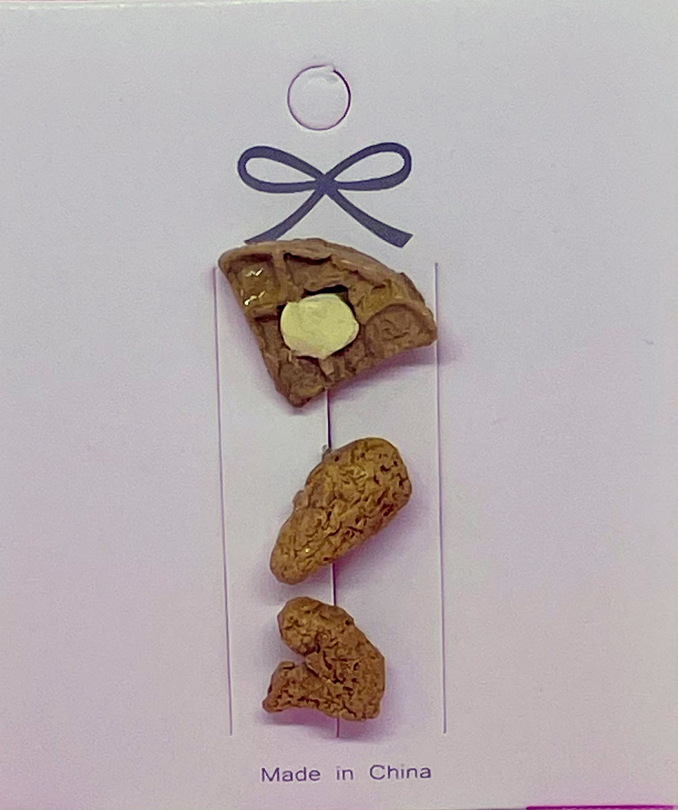 pins and brooches of handmade realistic chicken thy and a chicken drumstick and a waffle slice with melted butter on it