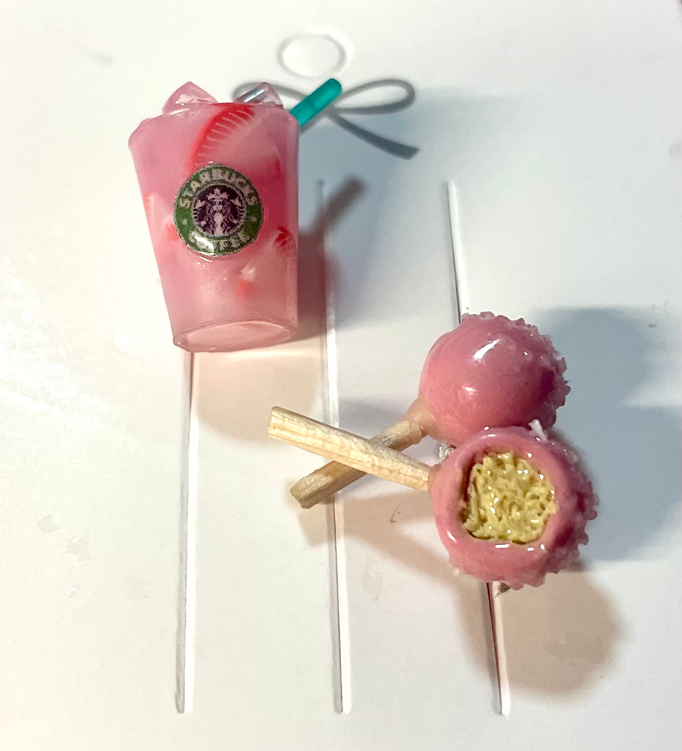 pins of starbucks pink drink with strawberries and ice and pink cake pops, one with a bite mark