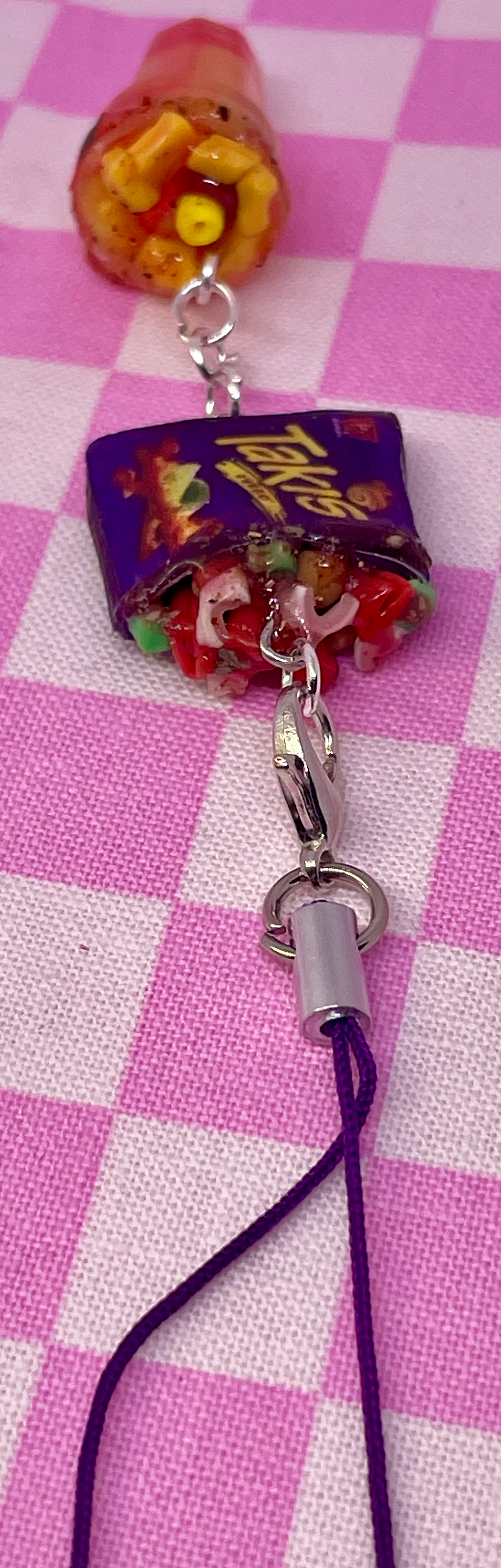 Thumbnail: food phone charm of a Mexican treat takiloco with taki chips and chamoy and tajin and a mangonada