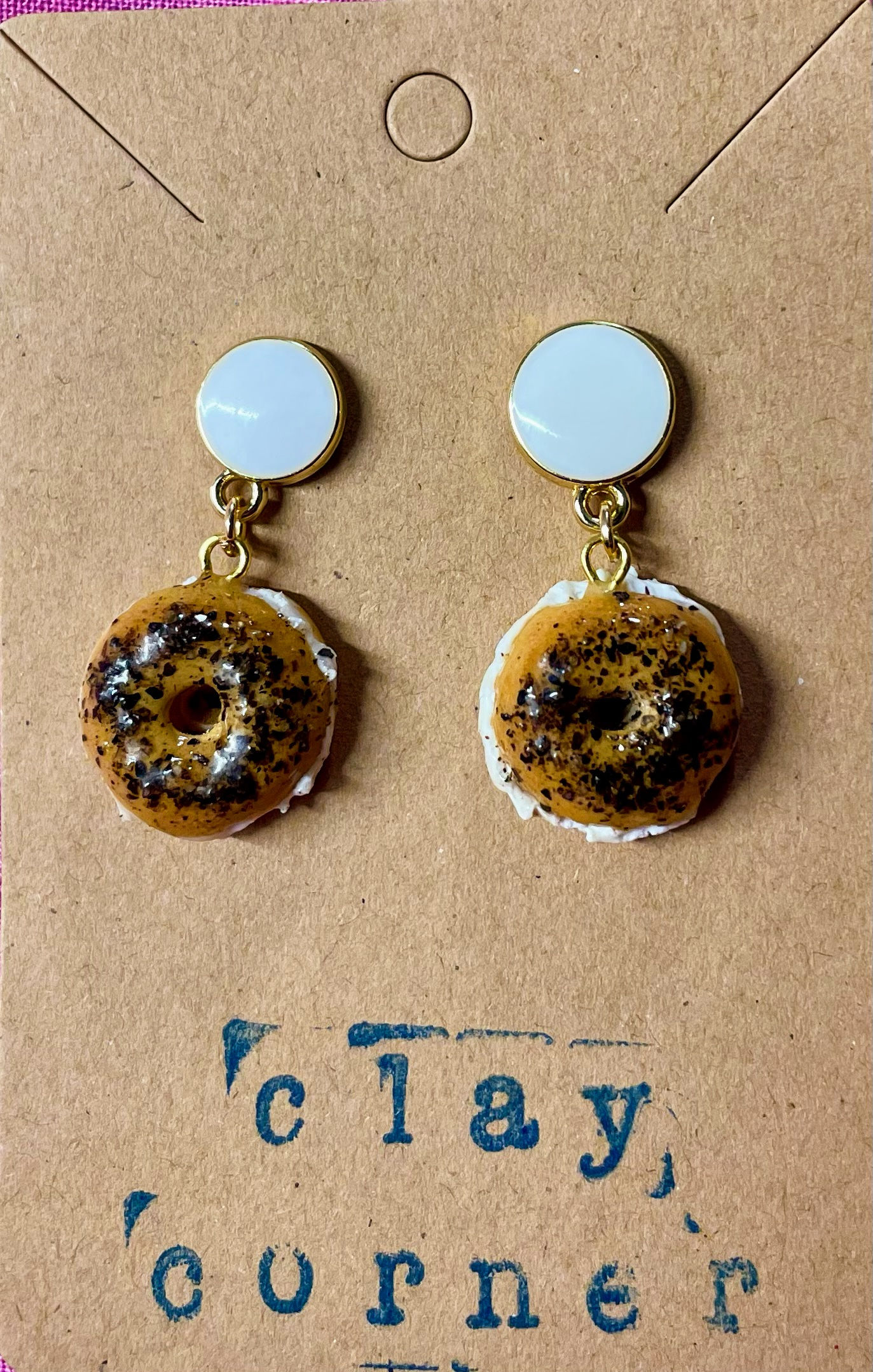 white circle drop earrings of a poppyseed bagel and cream cheese