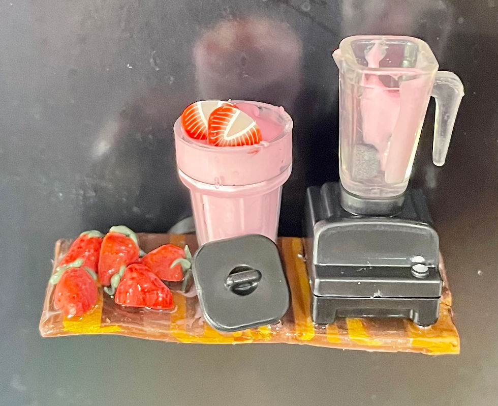 Thumbnail: fridge magnet of a blender with a strawberry smoothie and fresh strawberries and strawberry slices on a wooden shelf
