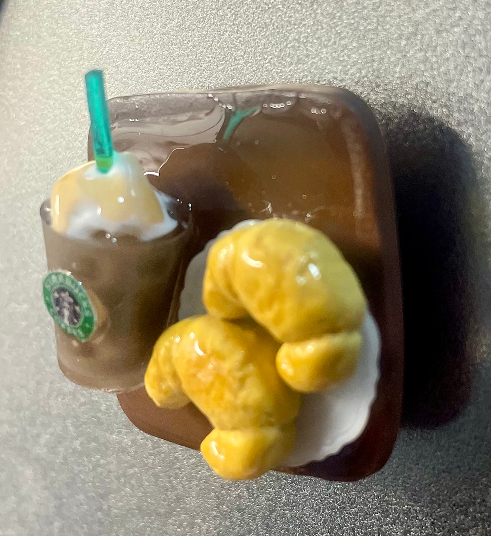 magnet of starbucks iced caramel latte with whipped cream and ice and croissant pastries