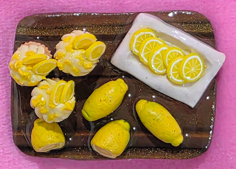 Thumbnail: Handmade lemon cupcake magnet crafted from polymer clay, featuring a detailed miniature cupcake design.