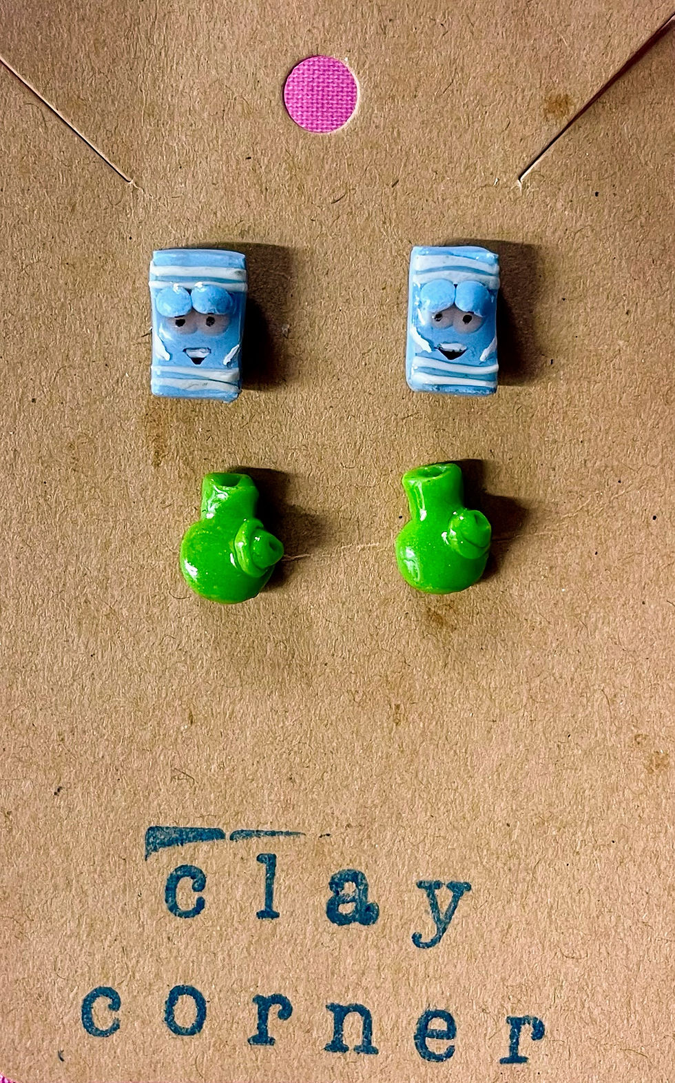 stud earrings of towlie from south park and a green bong