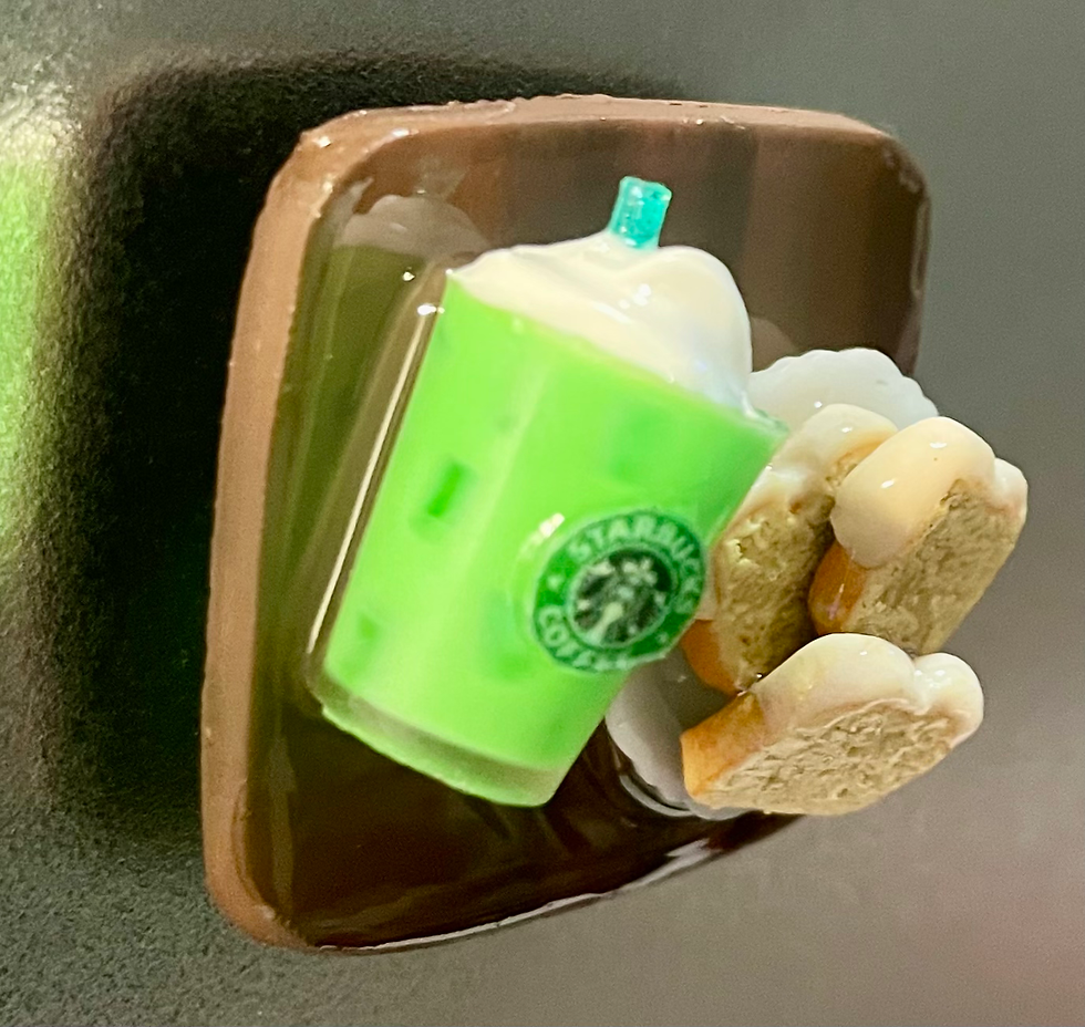 fridge magnet of starbucks matcha drink with whipped cream and ice and lemon loaf pastries