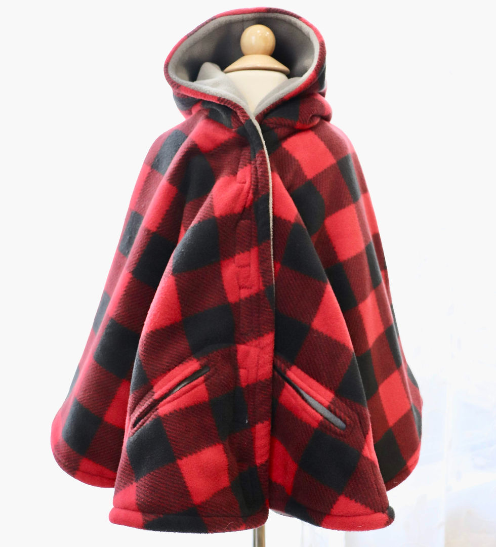 a red and black buffalo plaid poncho with grey lining