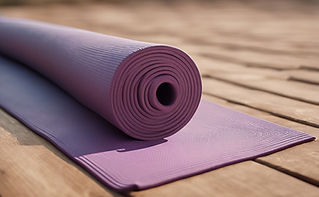 rolled yoga mat on the floor