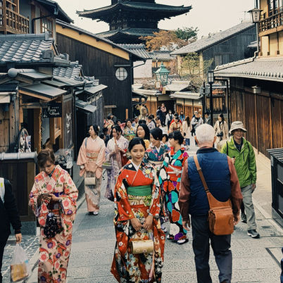 People walking along road leading to a pagoda in Japan. 