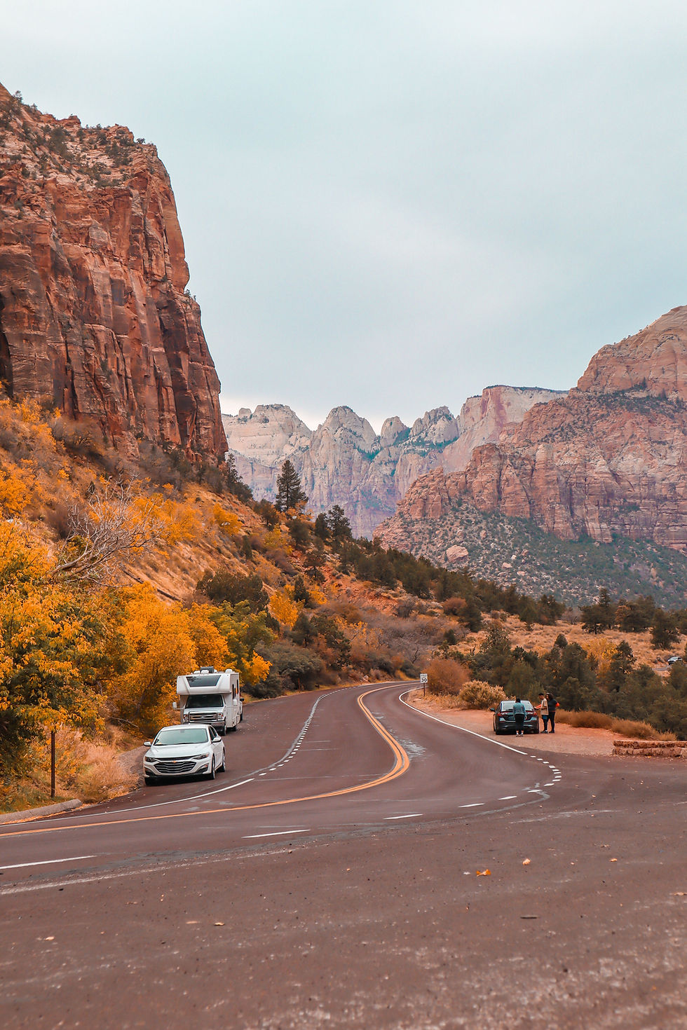 A winding road with cars in Zion National Park during autumn..jpg