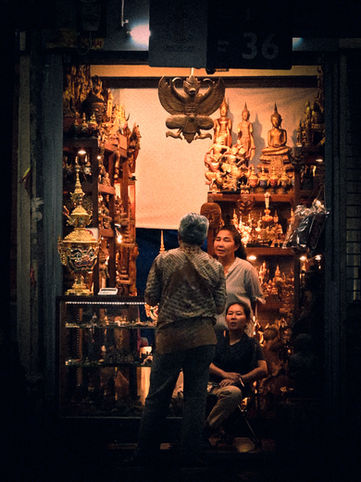 Golden Thai statues for sale at Chatuchak Weekend Market in Bangkok