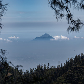 Mount Bromo summit peeking out above the clouds, Indonesia