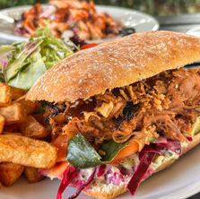 Korean BBQ pulled pork ciabatta with crispy onions and pickled veg at Farrington’s Café.