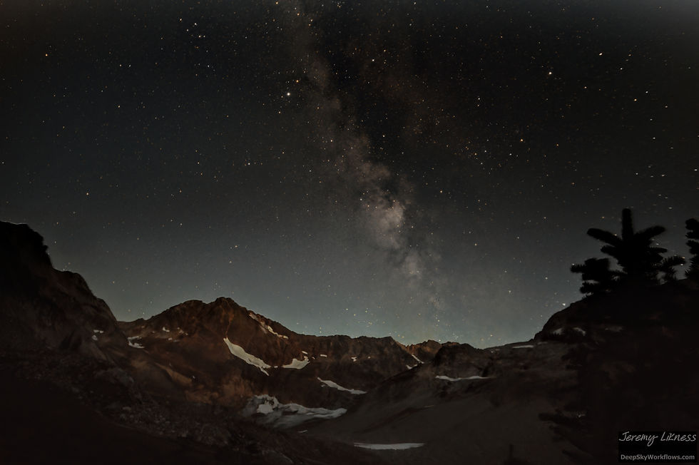 The milky way rises over a ridge in the Glacier Peak Wilderness area.