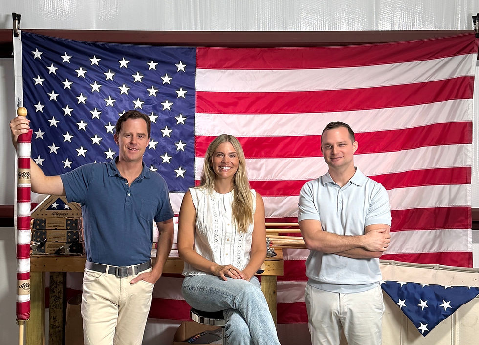 Founders Wes Lyon, Katie Lyon, and Max Berry pose with their American-made flags at their North Charleston facility. PHOTO PROVIDED