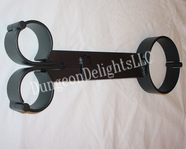 Top-down view of Inquisitor’s Fiddle restraint in black, shown closed with collar and wrist sections locked together.